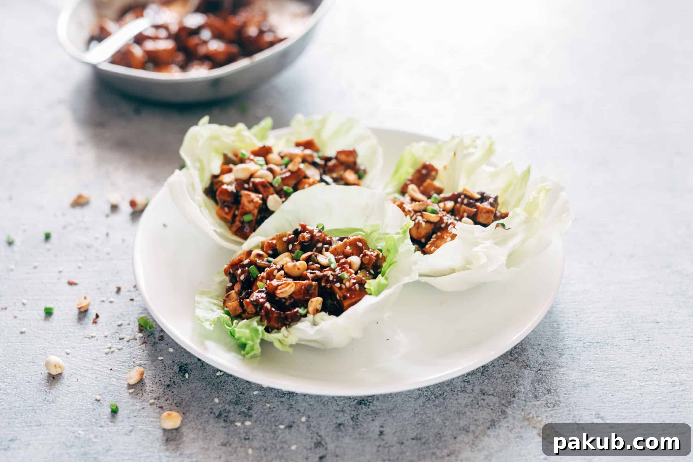 These vegetarian mapo tofu lettuce wraps serve as both a delightful appetizer and a light dinner, utilizing shiitake mushrooms instead of pork for that same great umami taste. They are also vegan and gluten-free.