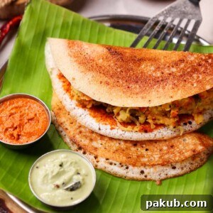 Serving Mysore Masala Dosa with two chutneys on a banana leaf