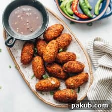 Crispy veg nuggets served on a platter with Sichuan sauce