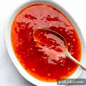 Thai sweet chili sauce served in a bowl with a spoon