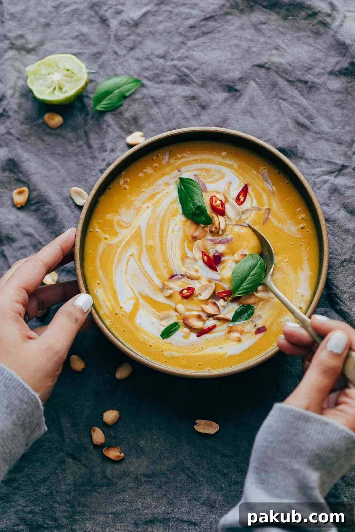 Creamy Thai Butternut Sweet Potato Bisque 2 A vibrant, creamy Thai Butternut Squash Sweet Potato Bisque, garnished and ready to be enjoyed. Perfect for cold weather, this soup combines sweet and savory notes with a hint of spice.