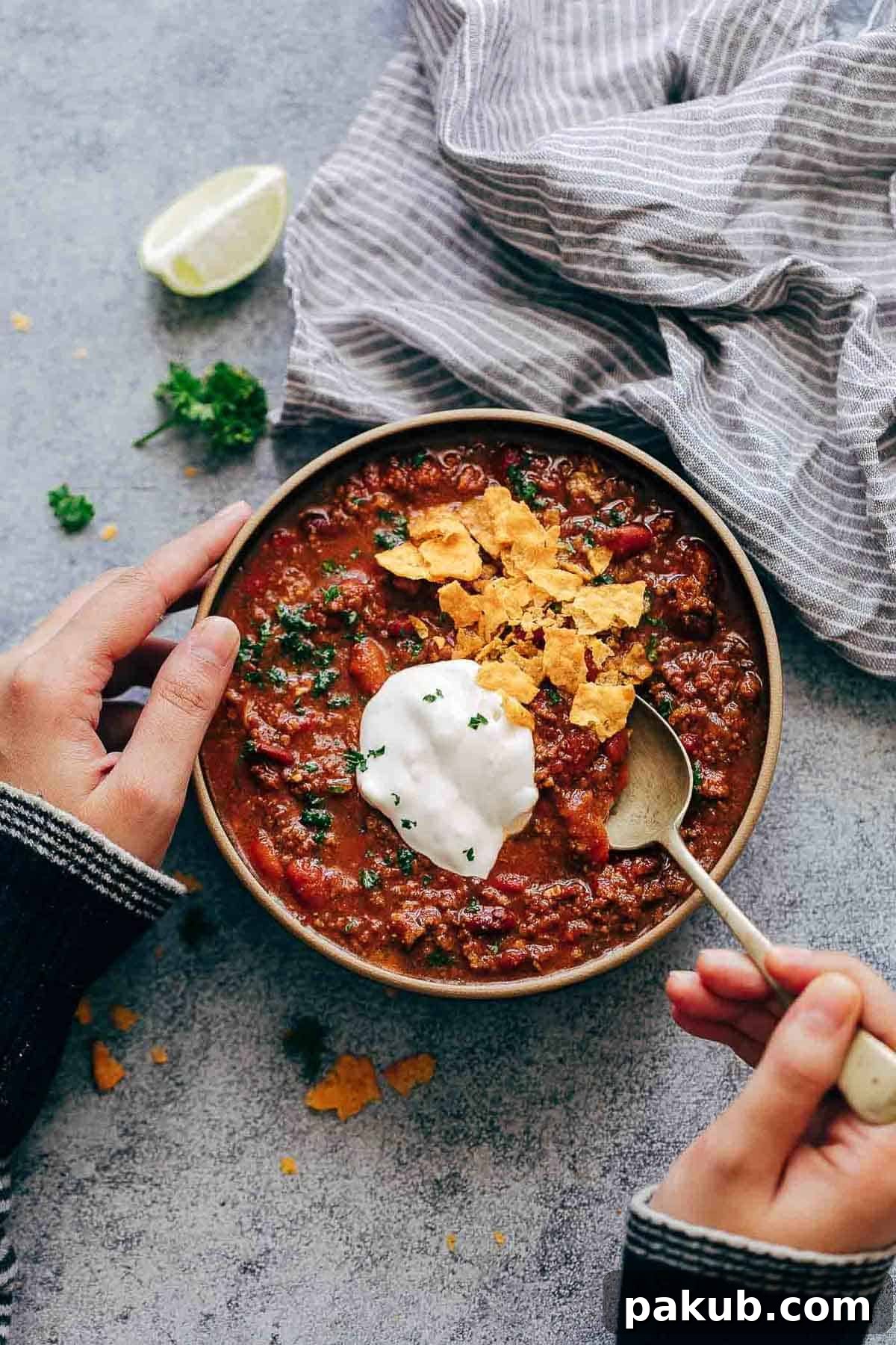 Hearty Instant Pot Chipotle Chili topped with fresh cilantro and a dollop of sour cream, ready to serve as the perfect comfort food.