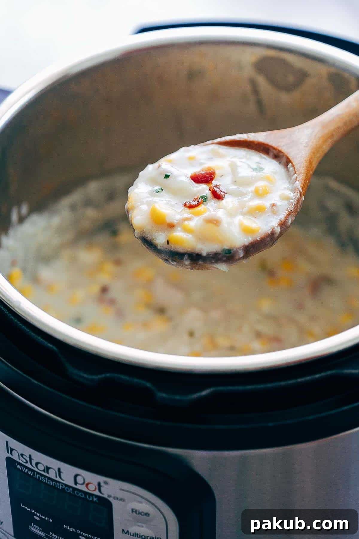 Instant Pot Chicken Potato Corn Chowder with Bacon being served.