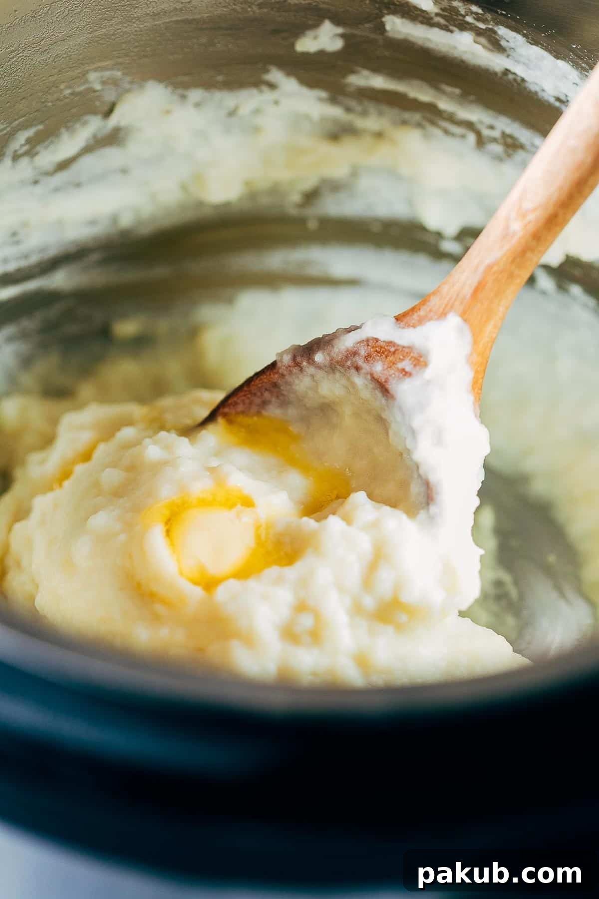 The process of blending the mashed potatoes directly in the Instant Pot liner, highlighting the creamy texture.