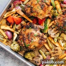 Honey Balsamic Chicken in a sheet pan with veggies.