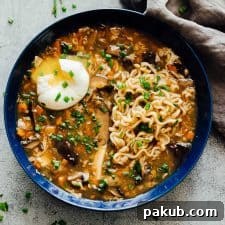 Hot and Sour Ramen Remix 5 A bowl of chinese hot and sour soup with ramen served with a soft boiled egg and green onions ready to eat!