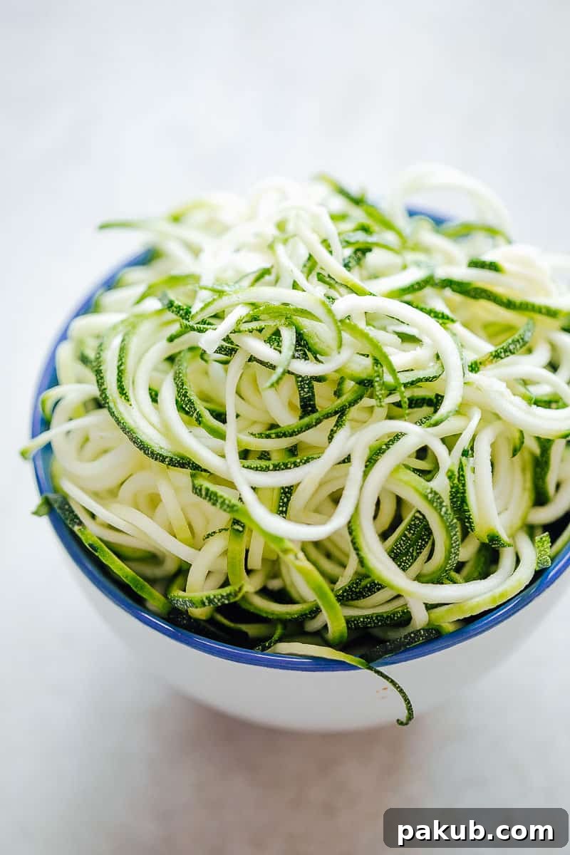 A bowl of fresh spiralized zucchini noodles ready for meal prep