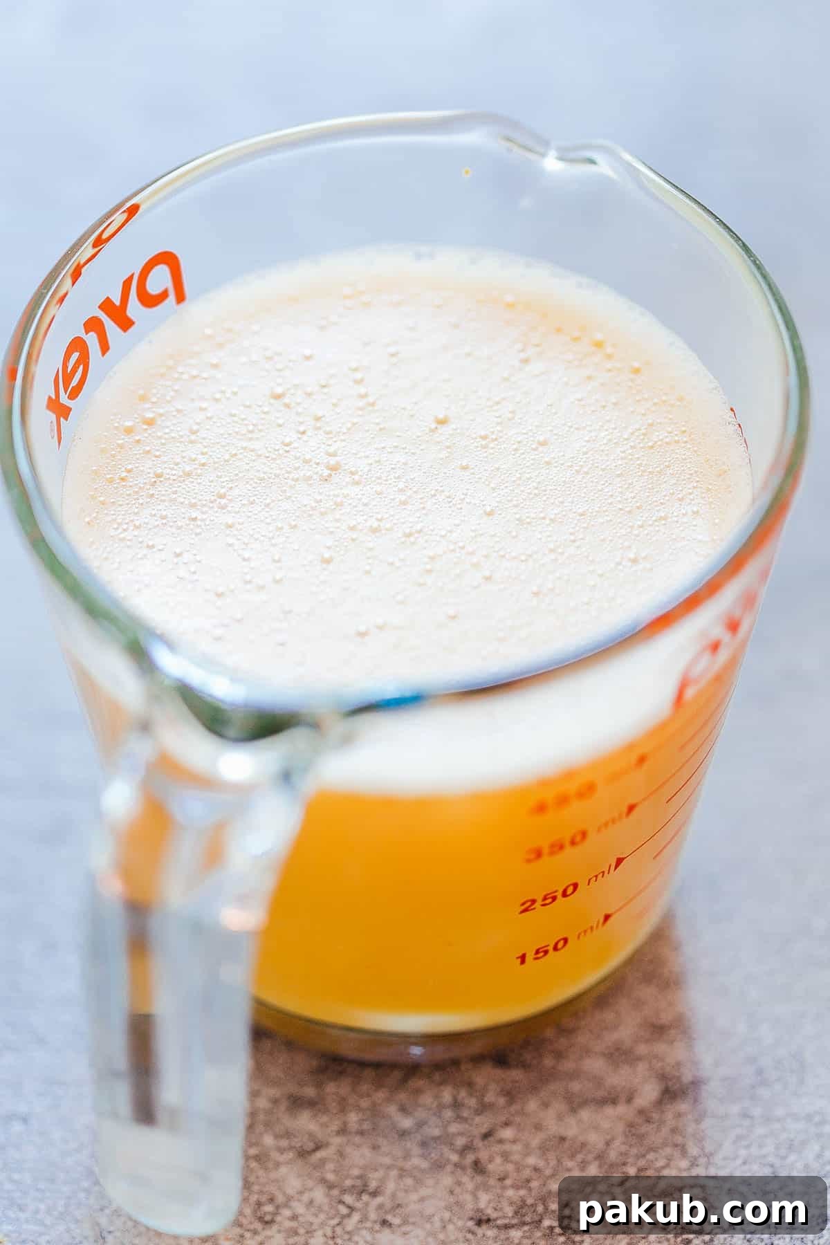 Denver Breakfast Bake 3 Close-up of foamy, perfectly whisked eggs, ready to be poured into the casserole for baking