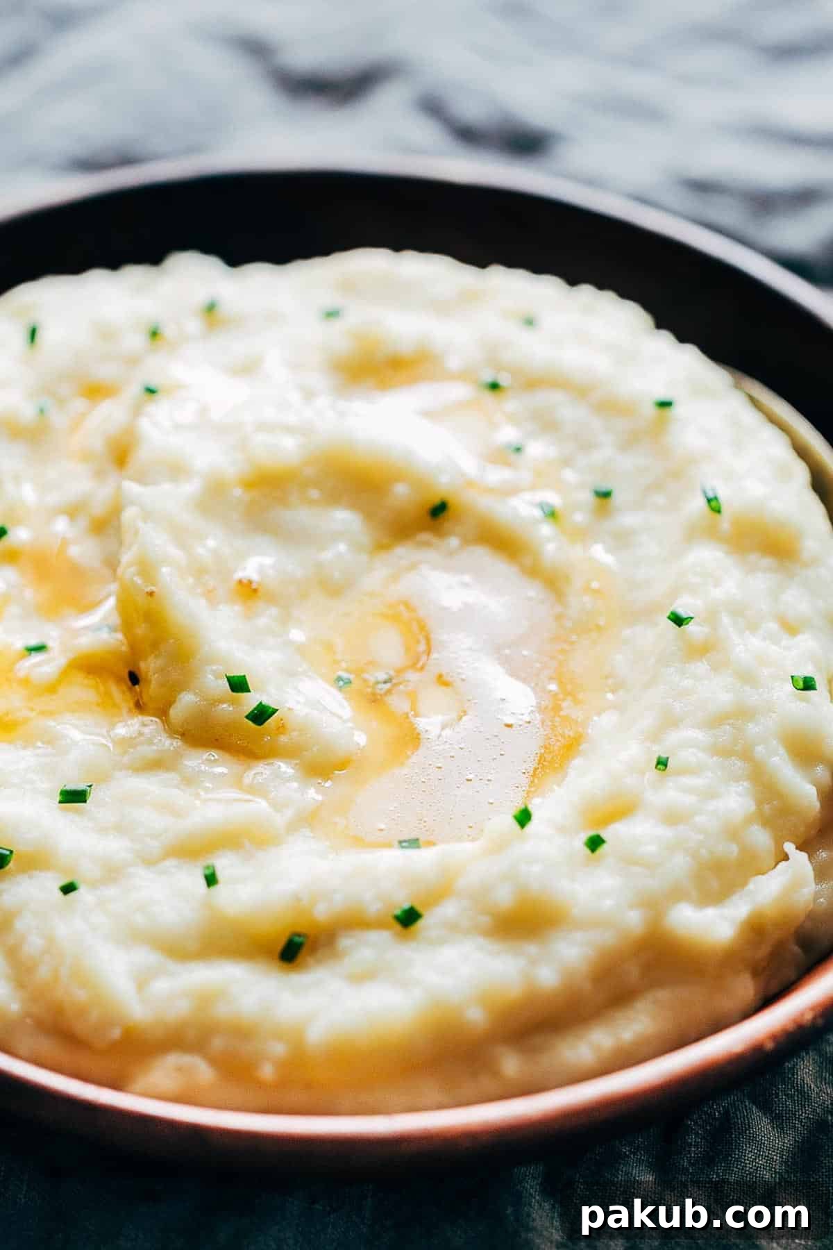 Master Your Instant Pot 21 Recipes for Every Meal 17 Creamy mashed potatoes flavored with garlic and served in a wooden bowl, a perfect Instant Pot side dish.