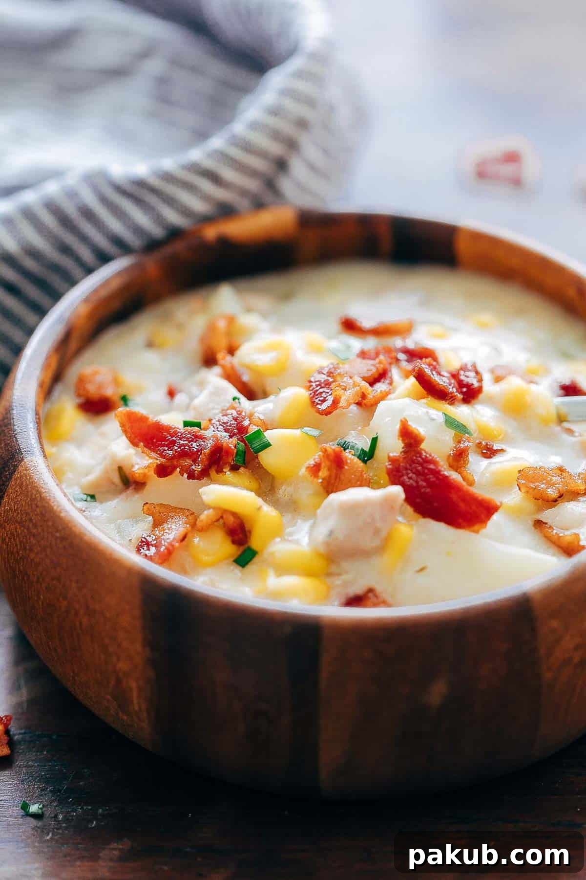 Master Your Instant Pot 21 Recipes for Every Meal 6 Hearty Instant Pot Chicken Potato Corn Chowder with Bacon served in a wooden bowl, a comforting meal.