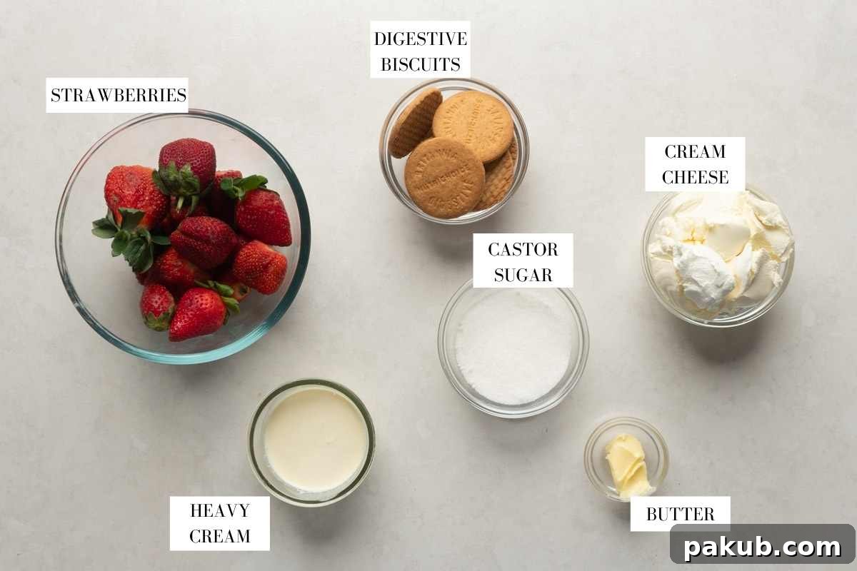 No Fuss Strawberry Cheesecake Jars 3 A flat lay photograph displaying all the fresh and simple ingredients required for making strawberry cheesecake jars: fresh strawberries, digestive biscuits, butter, castor sugar, cream cheese, and heavy whipping cream.