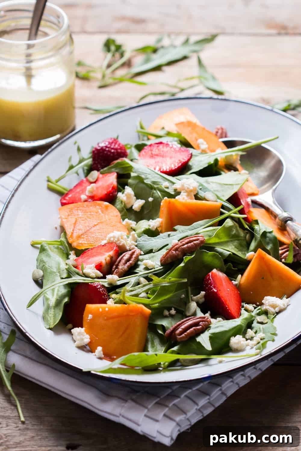 Light & Lively: 14 Summer Salads That Satisfy Without the Slump 12 An elegant Greens, Persimmon, and Ricotta Salad, featuring vibrant greens, sweet persimmon slices, and dollops of creamy ricotta cheese.