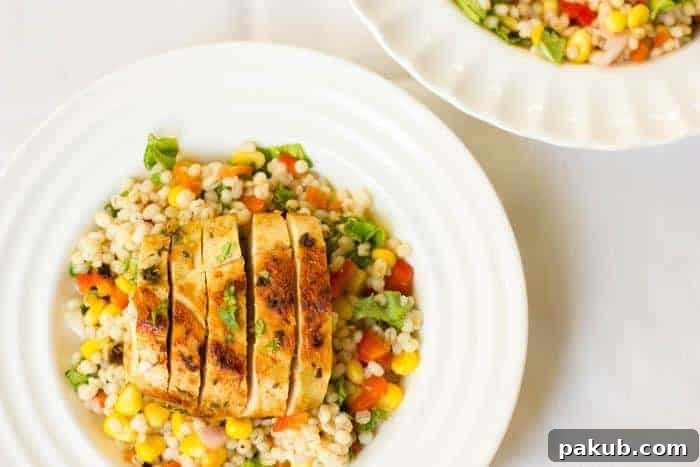 Light & Lively: 14 Summer Salads That Satisfy Without the Slump 15 A close-up of a hearty Barley Chicken Salad, showcasing tender chicken, plump barley, and fresh herbs.