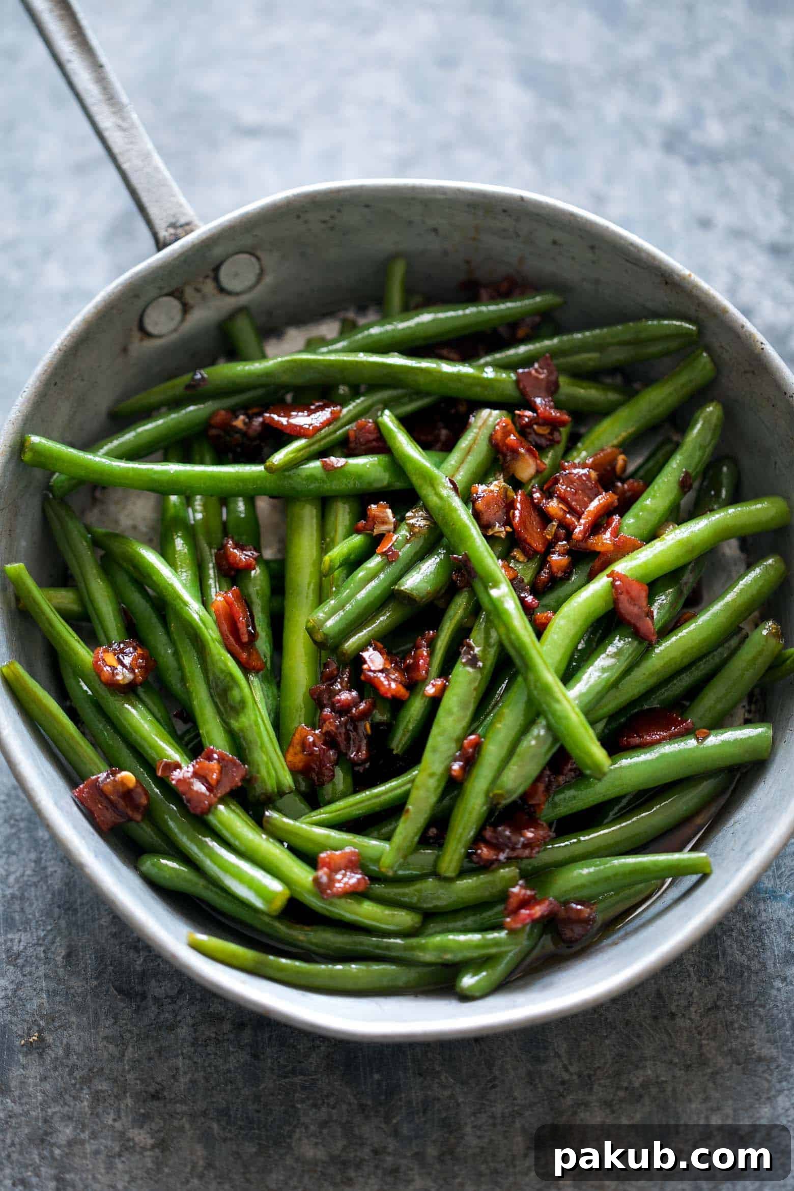 15 Bacon Creations to Make Every Meal a Party 5 A tantalizing plate of Sautéed Brown Sugar Bacon Garlic Green Beans, showcasing tender green beans, glistening candied bacon bits, and fragrant garlic. An insanely delicious side dish that promises both sweet and savory notes.