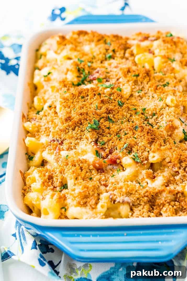 15 Bacon Creations to Make Every Meal a Party 9 A glorious three-cheese Bacon Mac and Cheese, bubbling and golden in a rustic blue baking dish, freshly pulled from the oven and ready to be devoured.