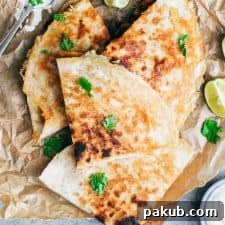 Chicken fajita quesadilla with crispy bits of cheese stuck to the fajitas
