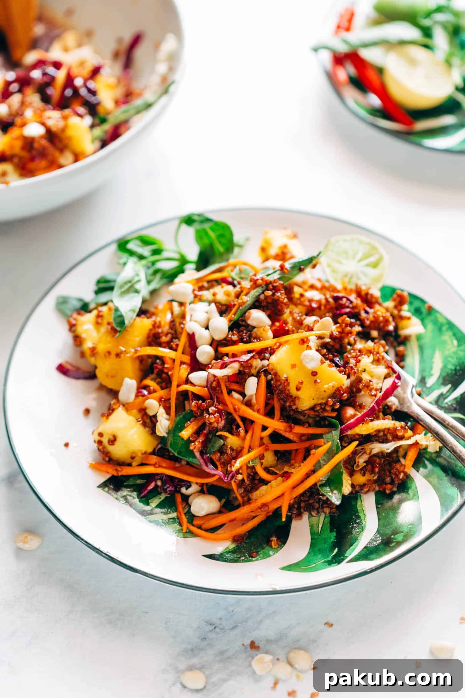 Super delicious Thai Peanut Mango Quinoa Salad which you can make ahead for potlucks and barbecues and also happens to be gluten free and vegan! Comes with a finger licking sweet and spicy sambal dressing that's different from the regular peanut dressing.