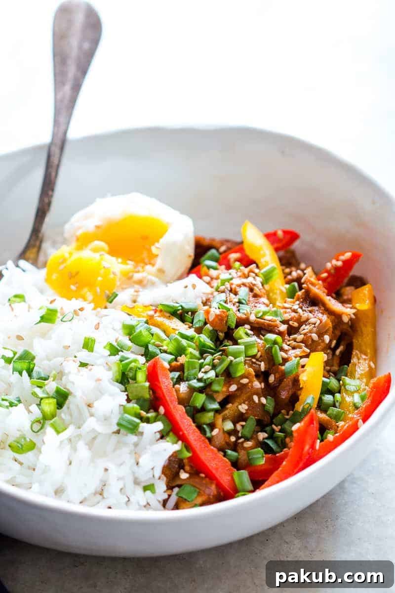 Easy Slow Cooker Korean Pork Bulgogi recipe that can be made in a crockpot and has spicy gohujang in it's marinade. Healthy, yummy stew that's perfect over rice for dinner!