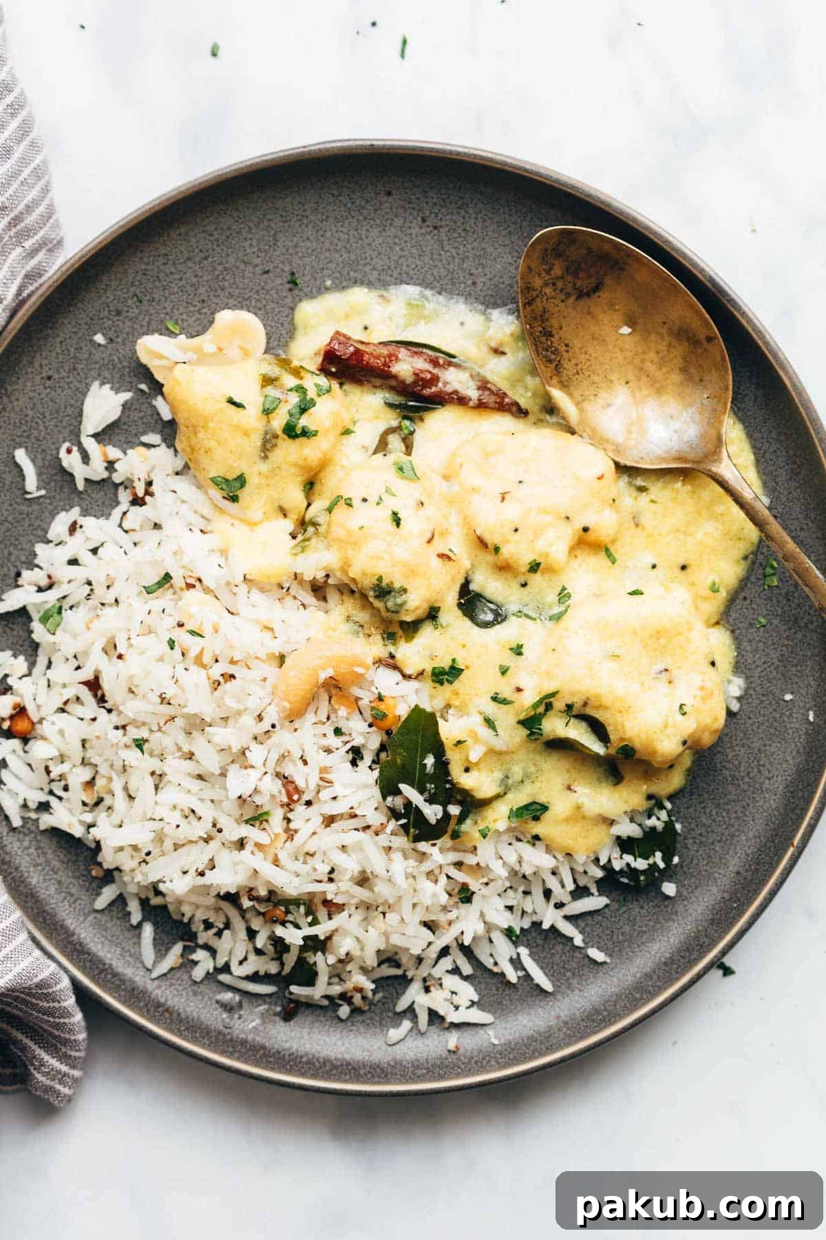 Quick & Easy 15-Minute Coconut Rice Stir-Fry 3 Coconut rice served with kadhi on a plate