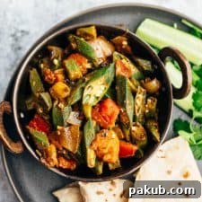 Effortless Spiced Okra Stir Fry 5 Overhead shot of bhindi masala served with chapatis and salad