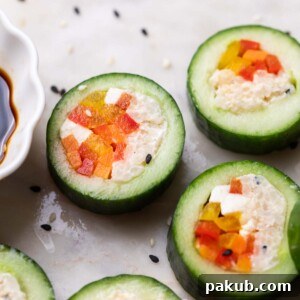 close up of cucumber sushi served with soy sauce