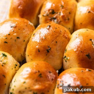 air fryer rolls brushed with butter and sesame seeds