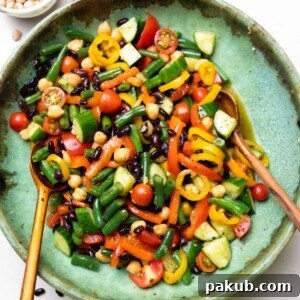 three bean salad served with wooden spoons