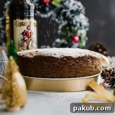 Last minute plum cake or christmas fruit cake set up on the table for slicing