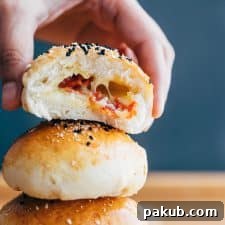 Bite shot of pepperoni cheese bombs showing the stuffing