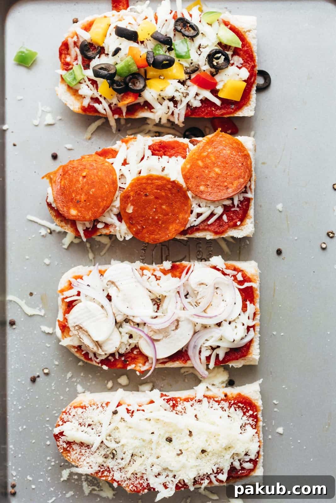 Crispy French Bread Pizza Melts 3 Toppings on french bread pizza toasts about to go into the oven