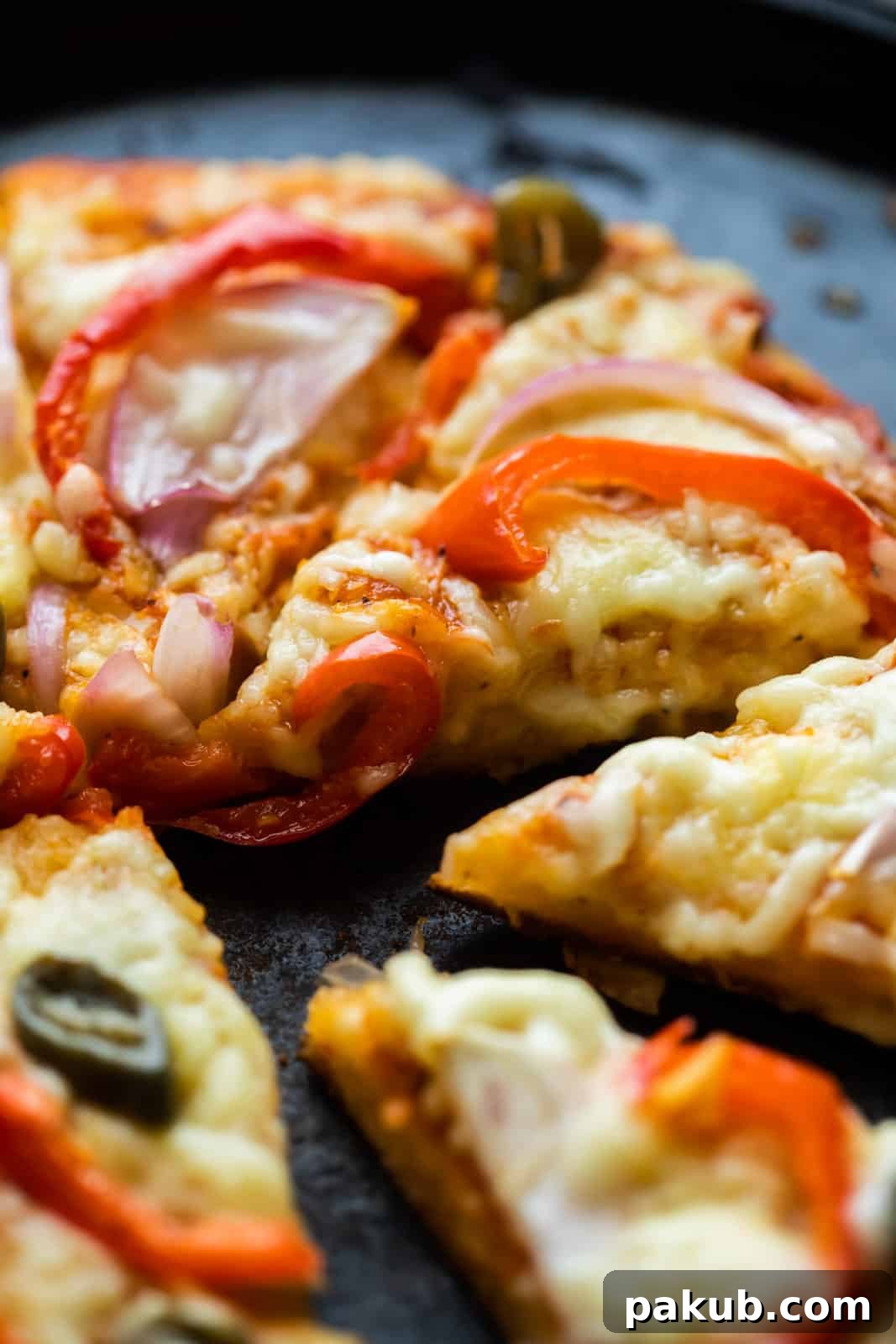 Close-up of a freshly cooked stovetop no yeast pizza with visible toppings and melted cheese