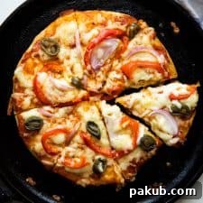 No yeast Pizza cooked on a cast iron skillet