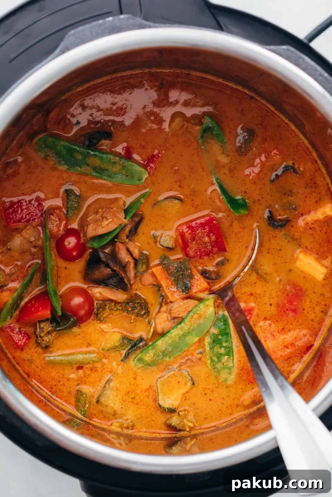 Flavorful Instant Pot Thai Chicken Curry 3 Red Thai Chicken Curry simmering beautifully in the Instant Pot, showing its rich, vibrant color and hearty texture.
