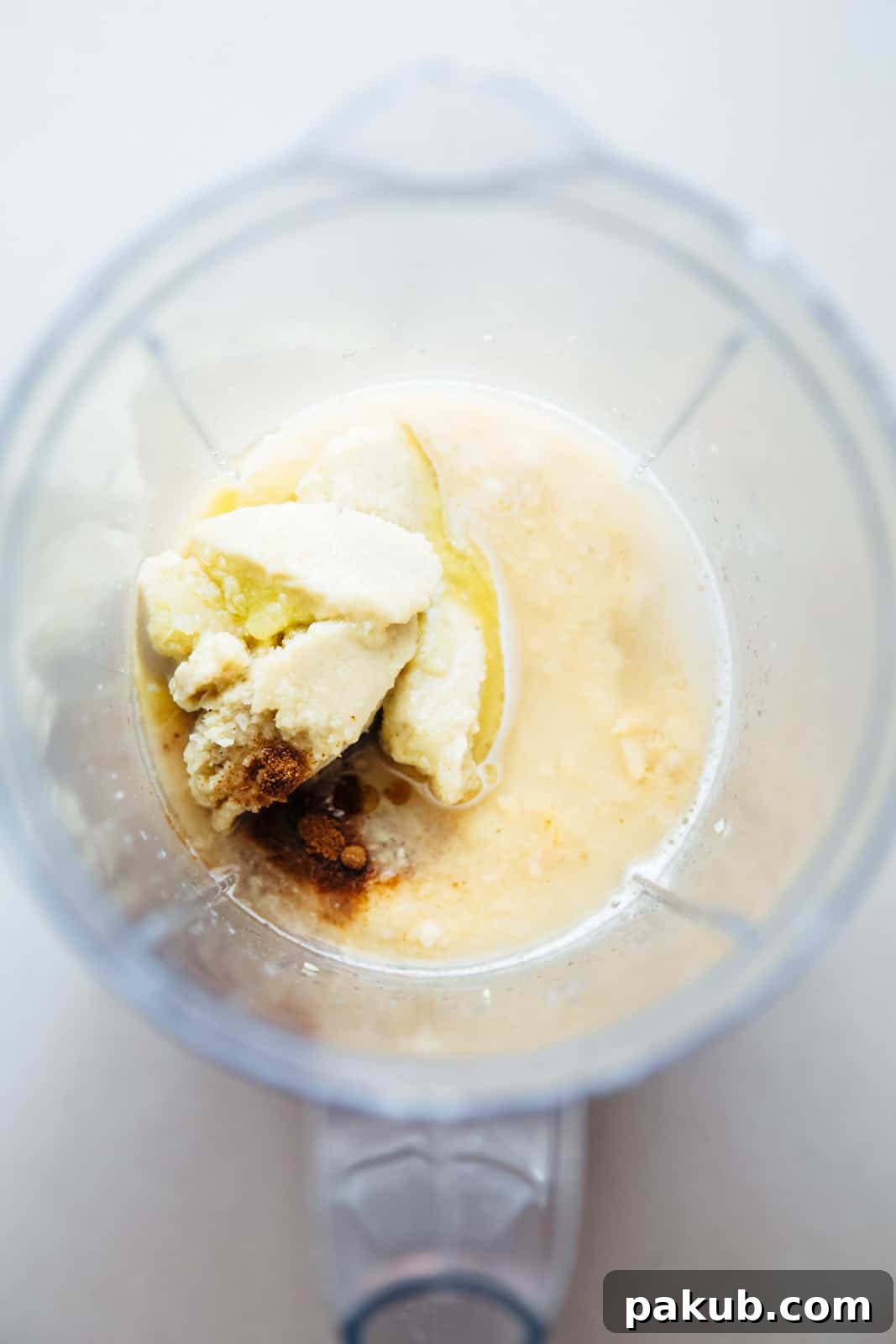 Whip Up Perfectly Light and Fluffy Homemade Hummus 5 Add tahini, paprika, cumin and water to blender