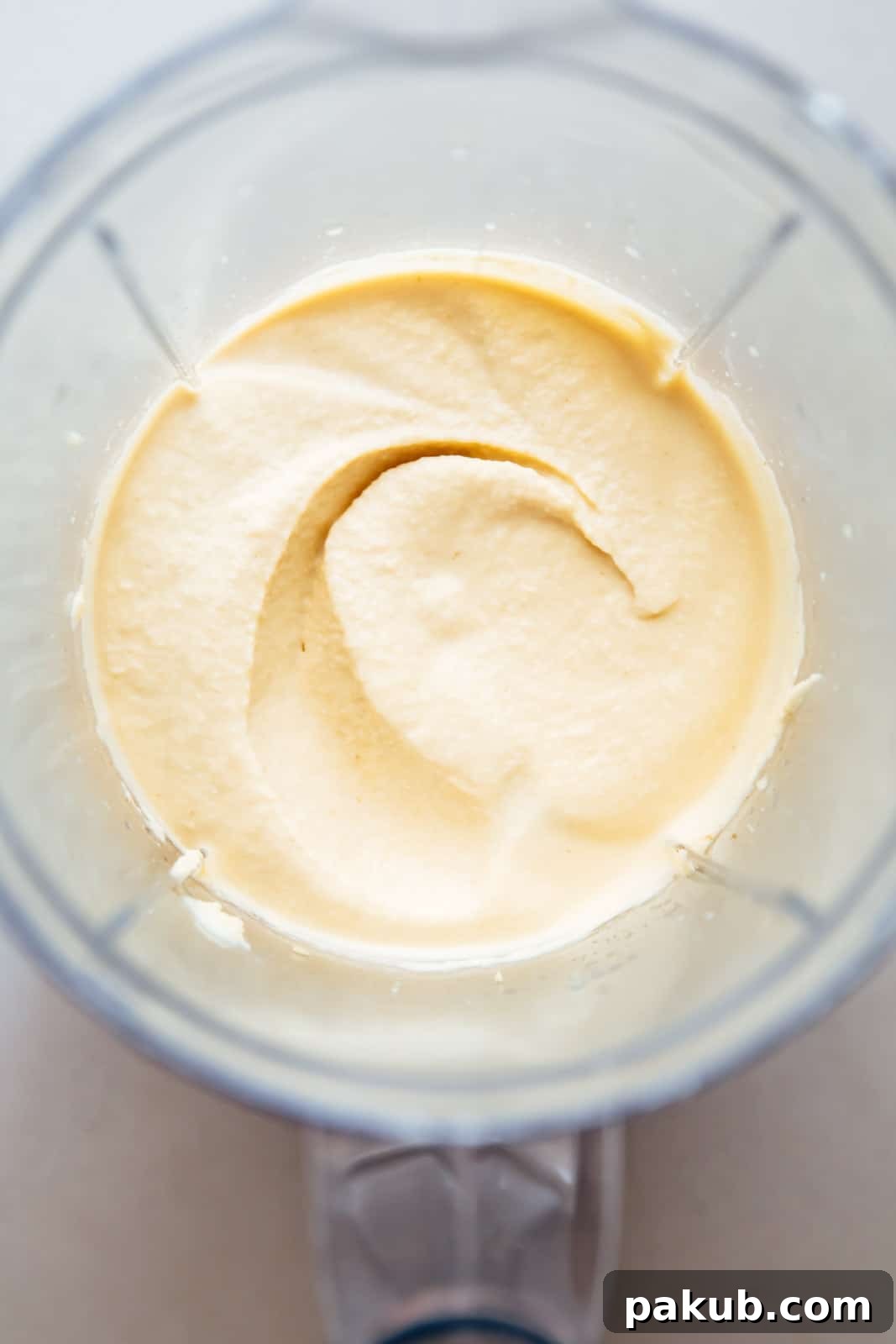 Whip Up Perfectly Light and Fluffy Homemade Hummus 6 Blend hummus till smooth