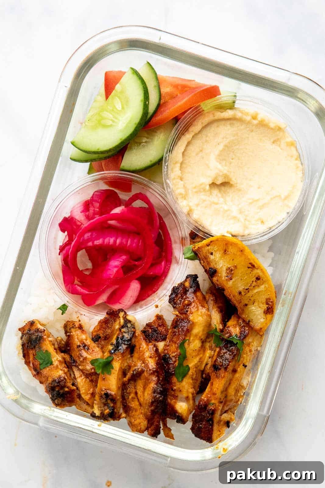 Homemade Street-Style Chicken Shawarma 5 Chicken shawarma prepped in a container with rice as meal prep