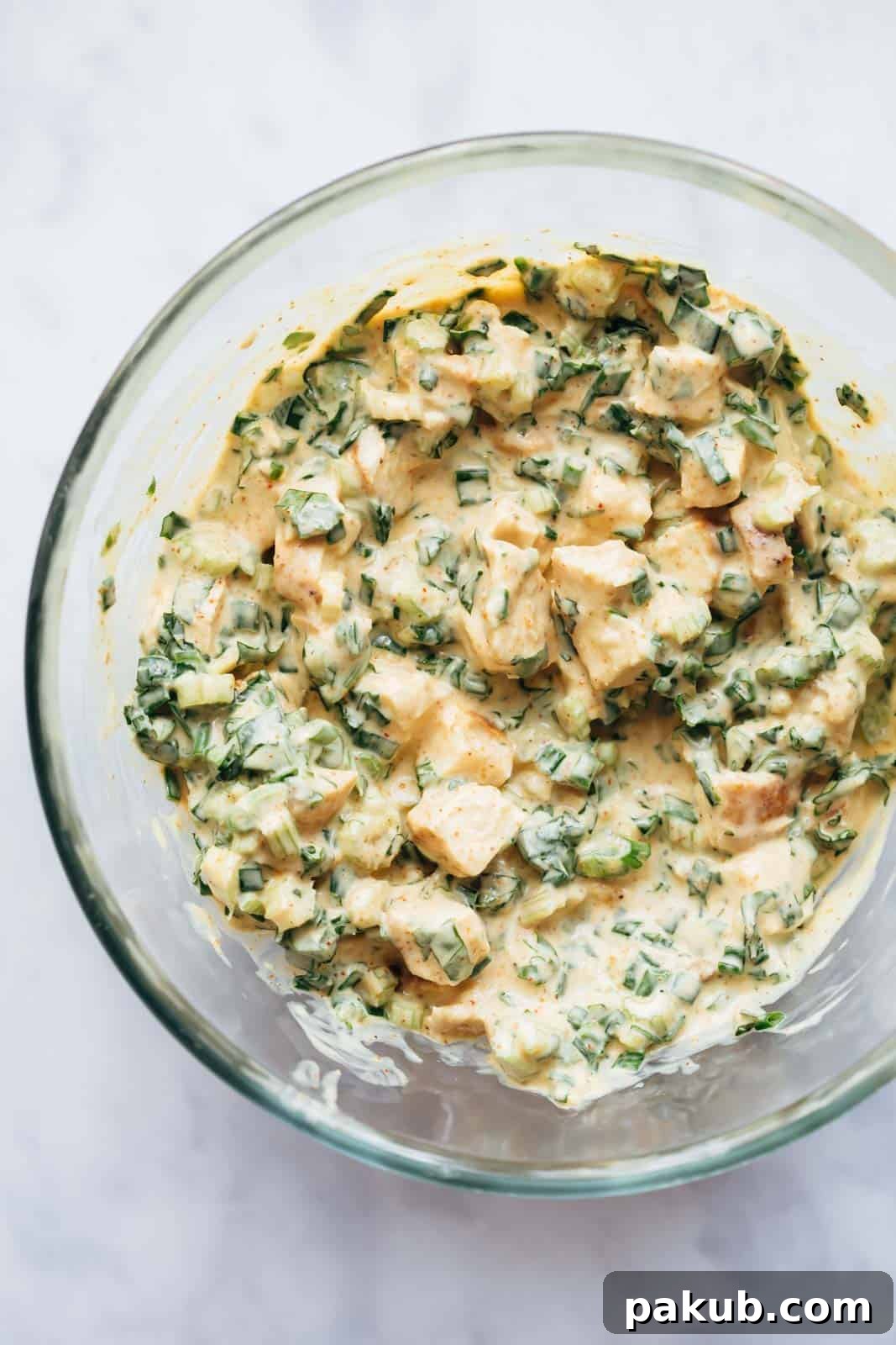 Delightfully Easy and Healthy Curry Chicken Salad Sandwich 3 Curry chicken salad in a large bowl, ready for serving or meal prep