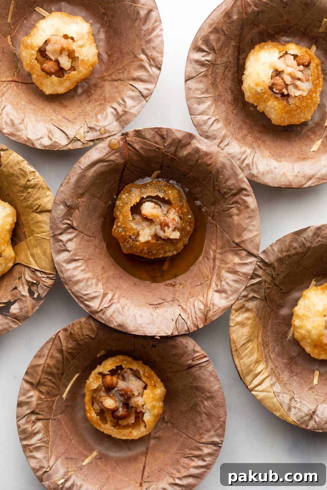 Effortless Homemade Pani Puri 2 Pani puri served in traditional pattals or leaf bowls, showcasing the vibrant Indian street food