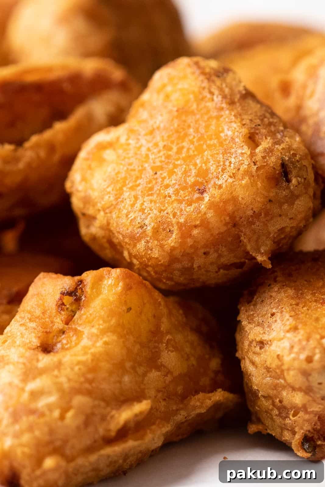 Closeup to show the crispy batter of paneer pakoras