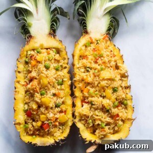 Thai Pineapple fried rice served in pineapple boats