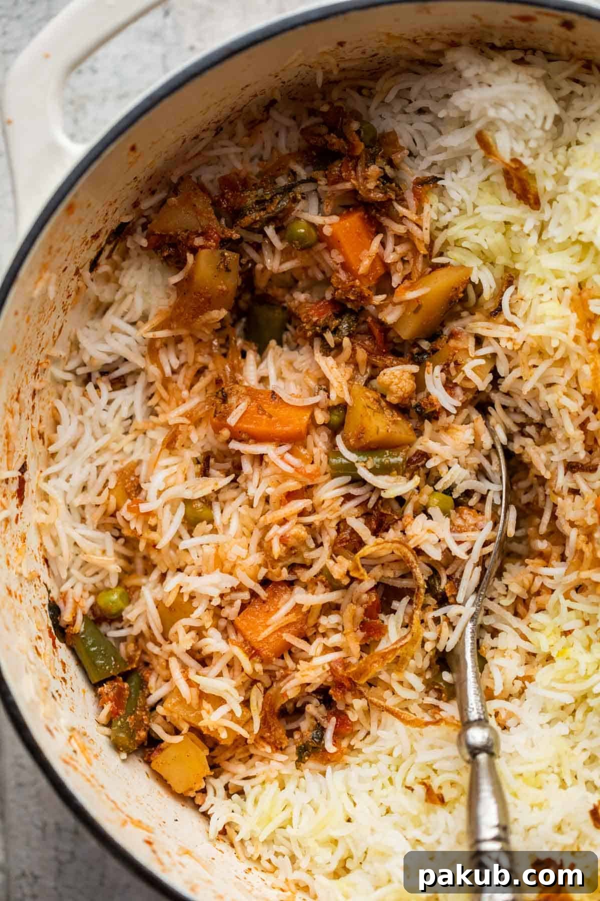 Mastering Delicious Vegetable Biryani 2 Closeup of perfectly cooked vegetable biryani, showing fluffy rice grains and vibrant vegetables in a traditional biryani pot.