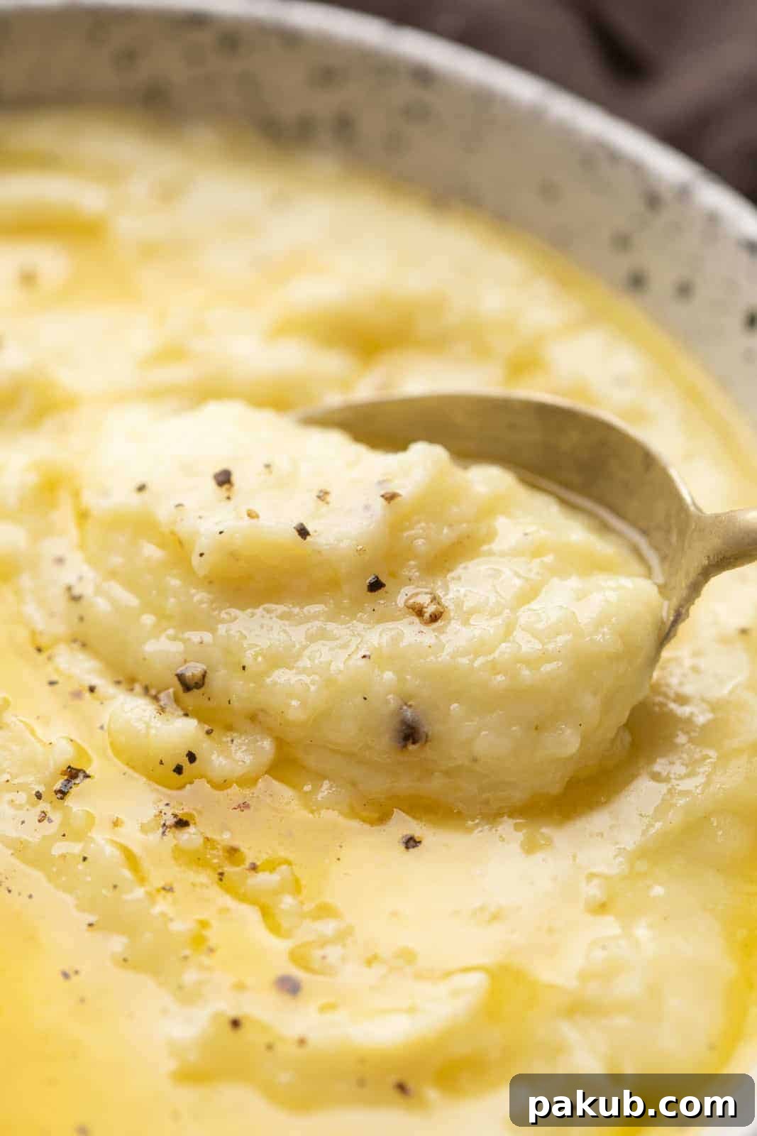 Decadent Garlic Mash 3 Closeup of a spoonful of creamy mashed potatoes