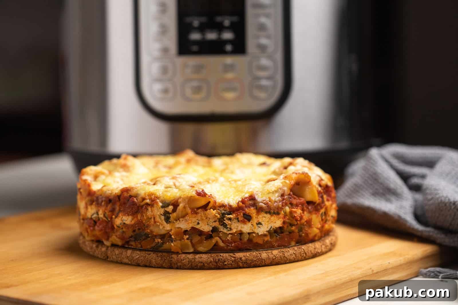 Your New Favorite Instant Pot Vegetarian Lasagna 3 Instant Pot lasagna served with the Instant Pot in the background
