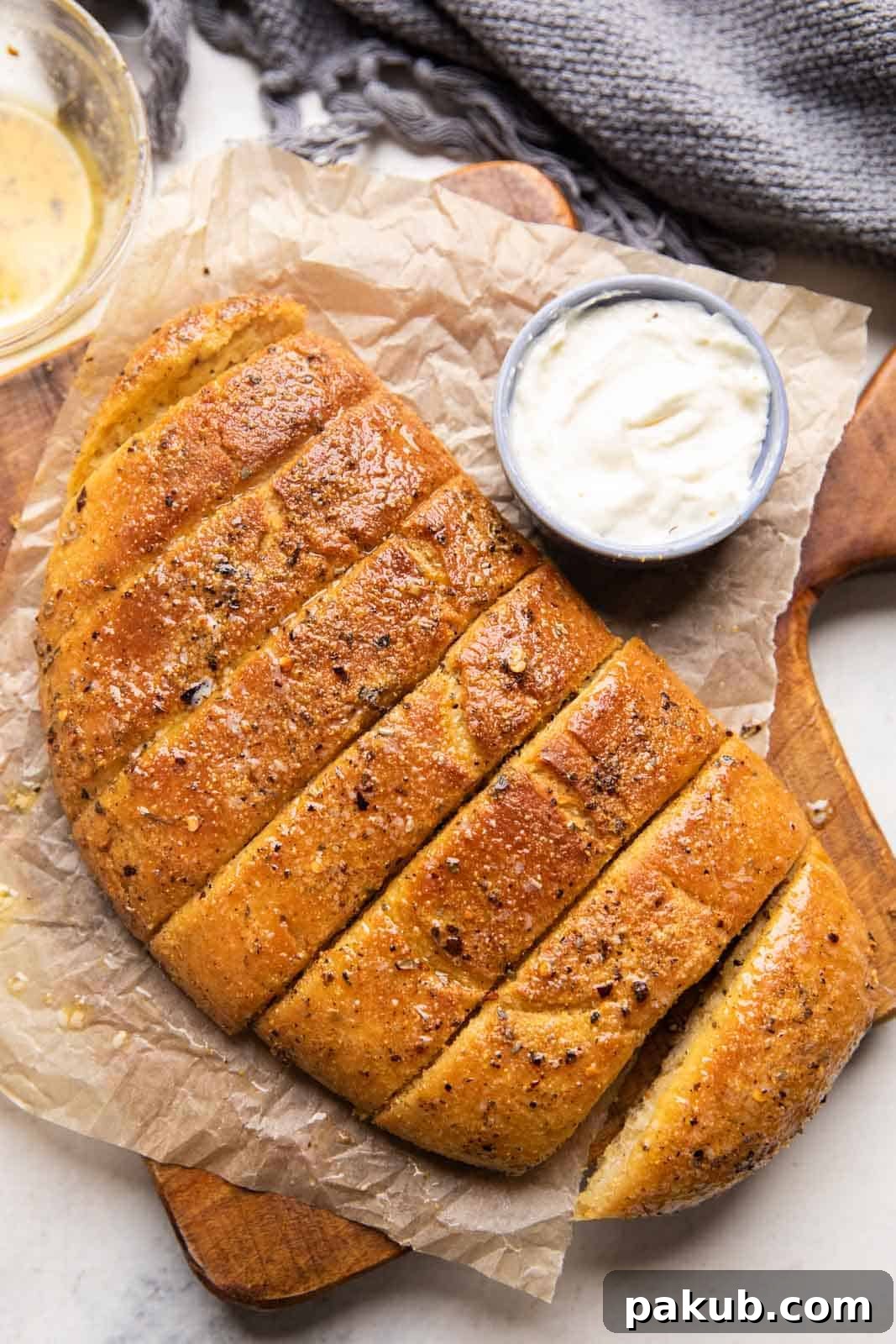 Ultimate Garlic Breadsticks Two Irresistible Styles 2 Dominos style garlic breadsticks served with a delectable cheesy dipping sauce, showcasing their golden-brown, crispy exterior and inviting aroma.