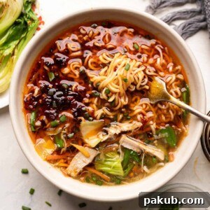 Chicken thukpa served with ramen noodles, veggies and some bok choy and spring onions on the side