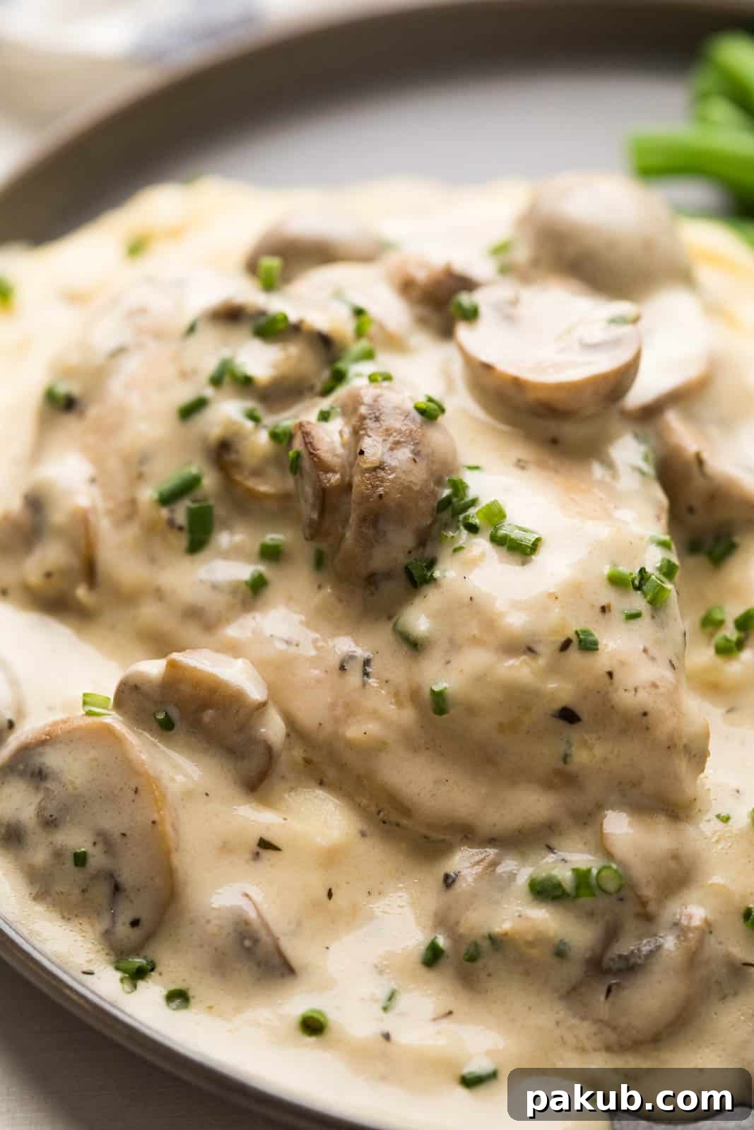 Instant Pot Creamy Mushroom Chicken 5 Closeup of creamy mushroom sauce ladled generously over tender chicken breast