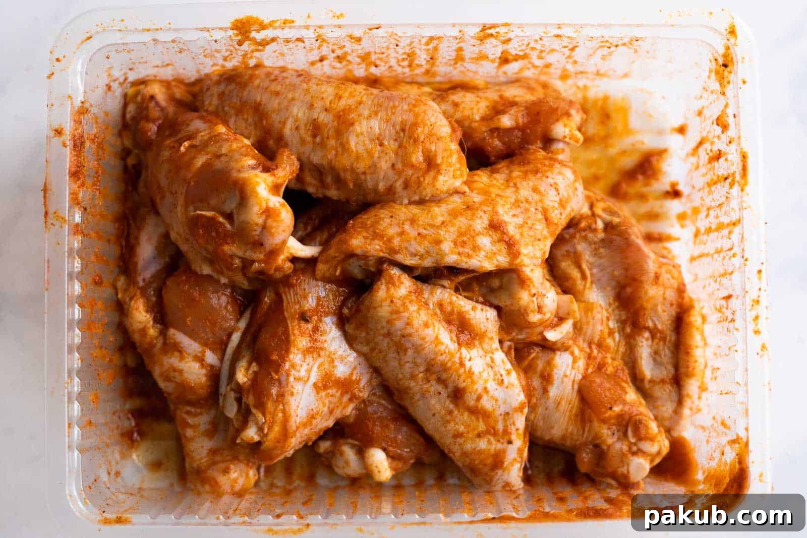Kickin' BBQ Chicken Wings 3 Marinated Chicken Wings in a disposable container