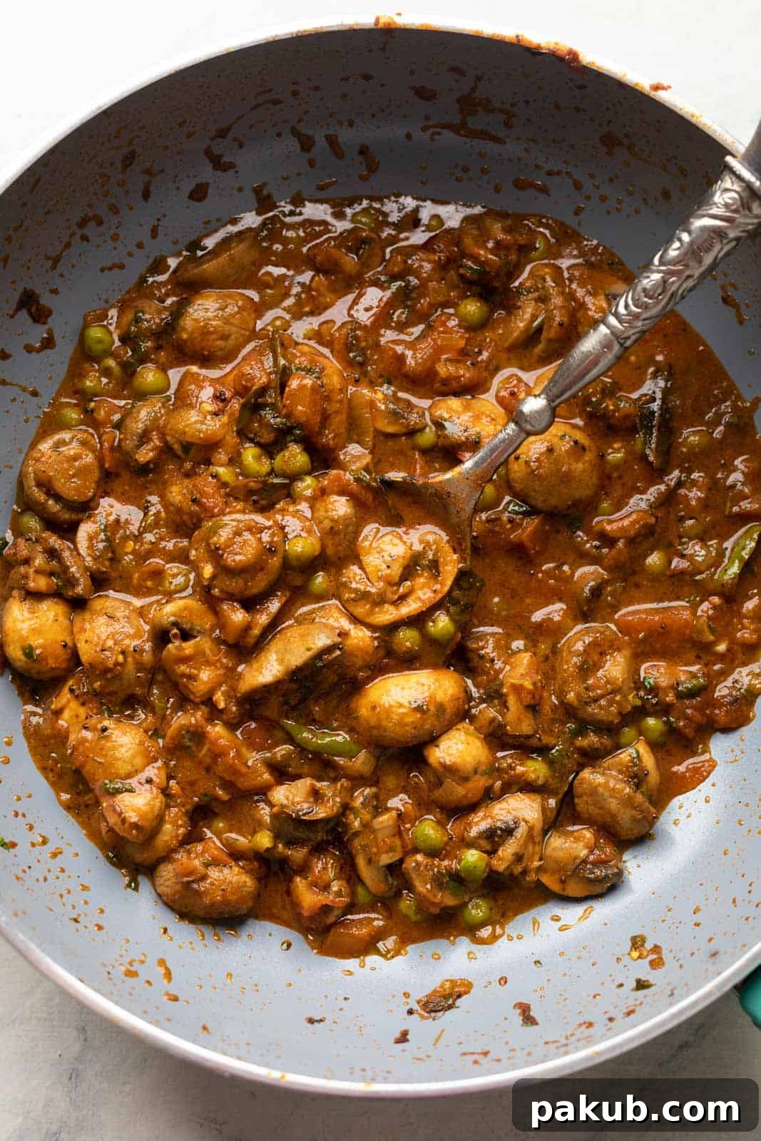 Restaurant Style Mushroom and Pea Masala 3 Mushroom Masala photographed in the kadhai that it was made in