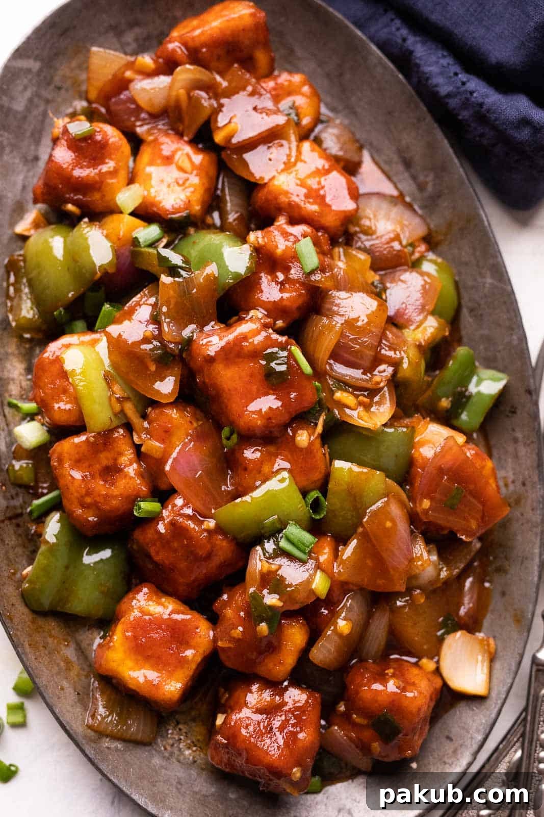 Chilli Paneer served on a platter, ready to be eaten