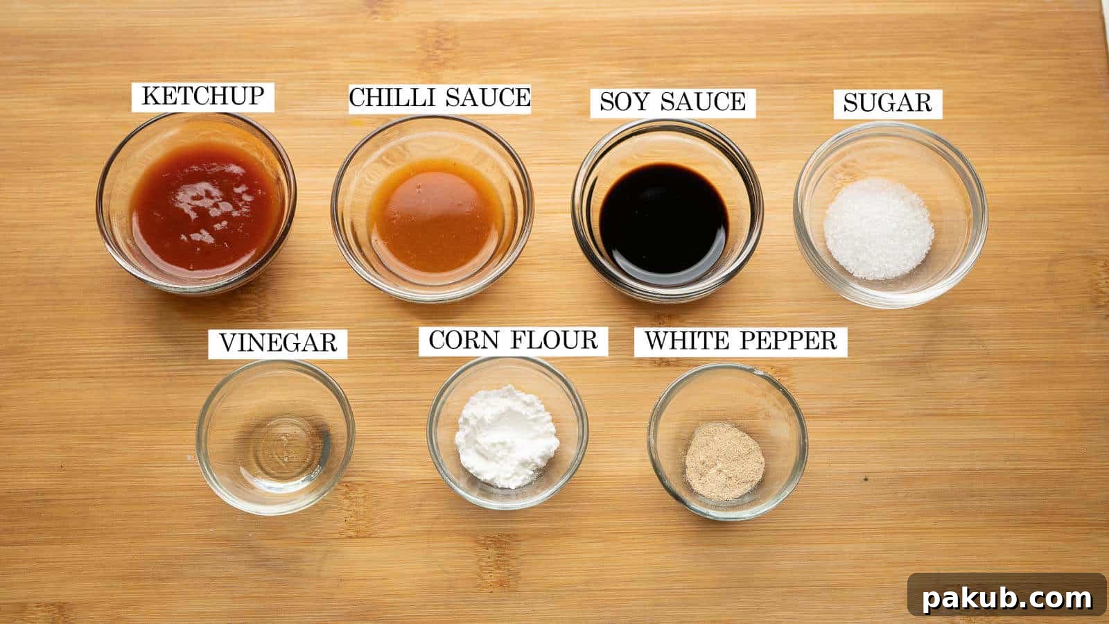 Easy Crispy Gobi Manchurian 4 A selection of sauces and seasonings, including soy sauce, ketchup, and chili sauce, laid out for making Gobi Manchurian.